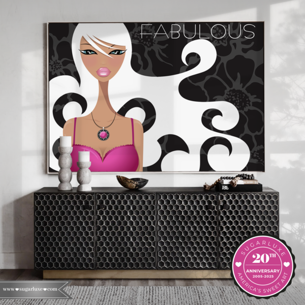 A room with a large framed artwork of a stylized woman in black and white and hot pink, magenta colors; decorative objects sit on a hexagon-patterned credenza below. Transcribed Text: FABULOUS SUGARLUXE Modern Art CANVAS GICLEE | CLASSIC COLLECTION | AVAILABLE NOW www.sugarluxe.com SUGARLUXE 20TH ANNIVERSARY 2005-2025 AMERICA'S SWEET ART