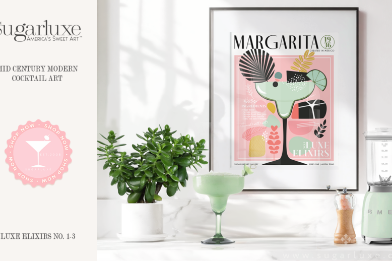 Modern kitchen display with Sugarluxe branding, home decor, and a framed cocktail art print. There is a countertop with a green succulent plant in a white pot, a green frozen margarita in a glass with salt on the rim, and a light green Smeg blender. Behind these objects is a framed art piece depicting a stylized margarita glass with abstract decorative elements and the word "MARGARITA." The colors in the art are primarily pink, green, and black, aligning with the modern aesthetic.